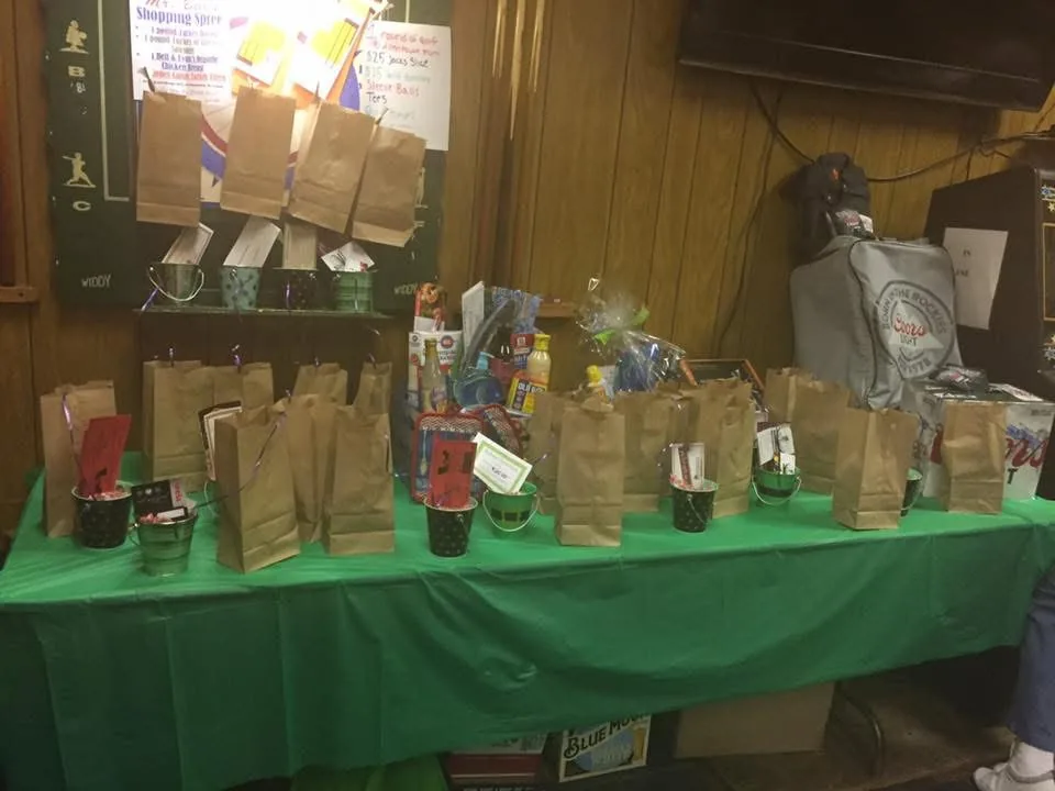 A picture of the prizes table, displaying multiple baskets.